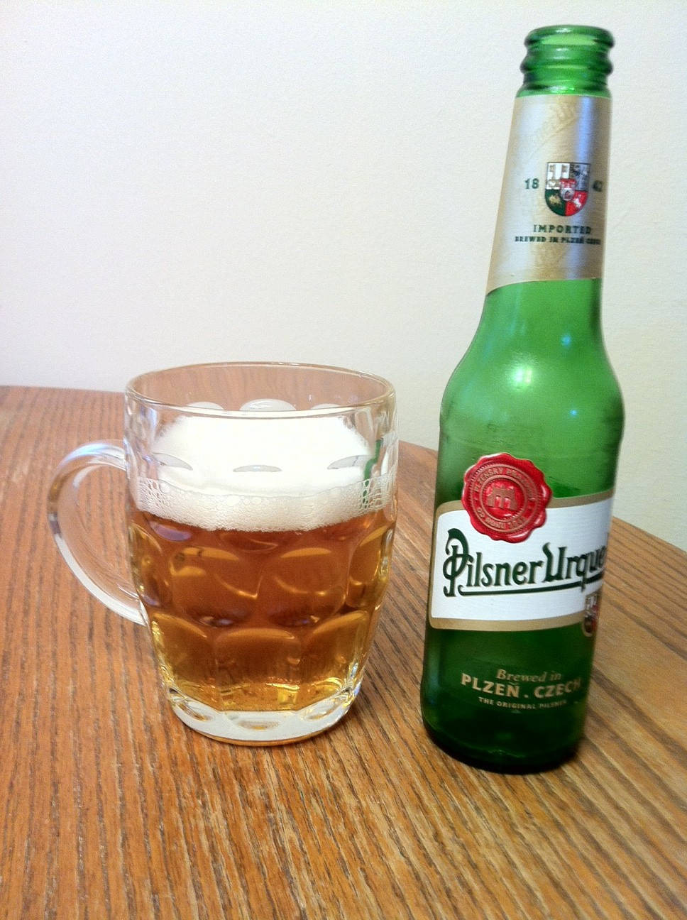 Refreshing Pilsner Urquell In Glass Background