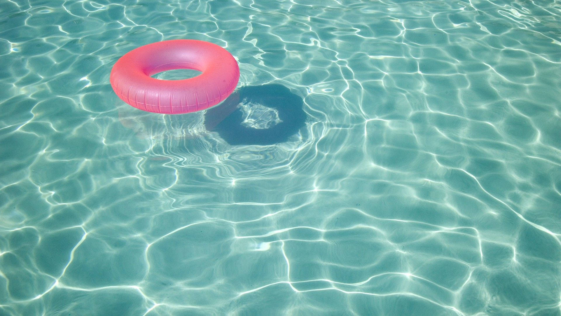 Refreshing Pool With A Pink Float