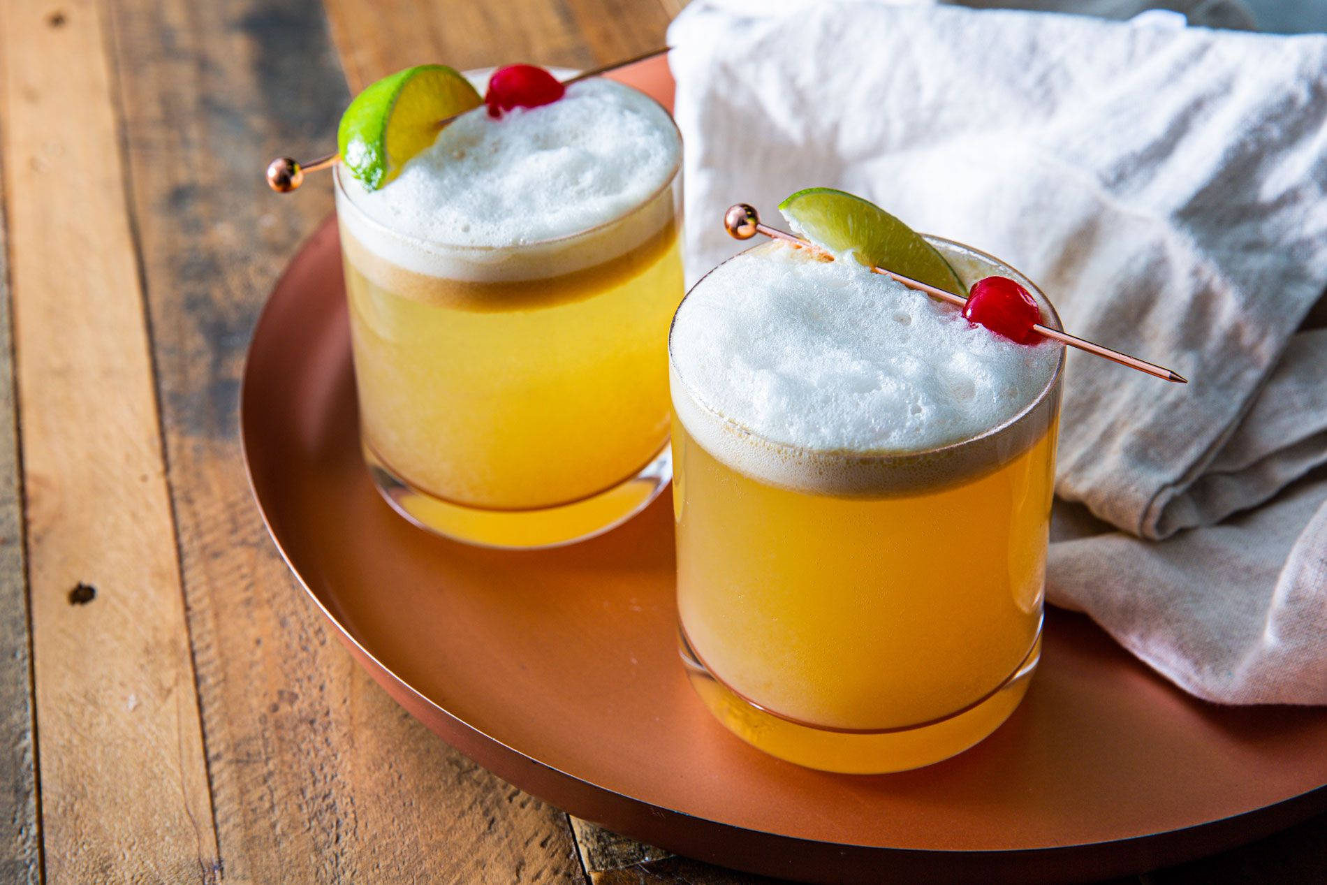 Refreshing Whiskey Sour Cocktail With Lime Background