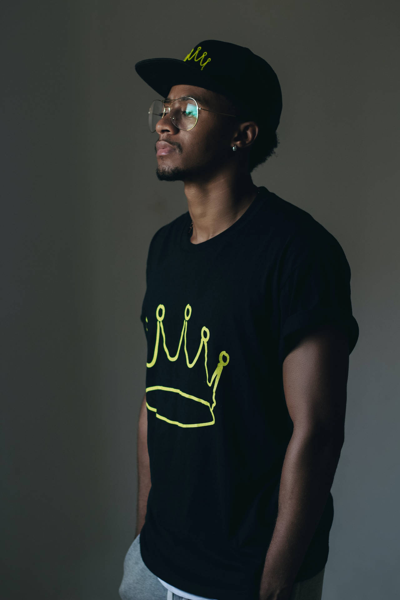 Regal Black Man Adorned With A Crown Background