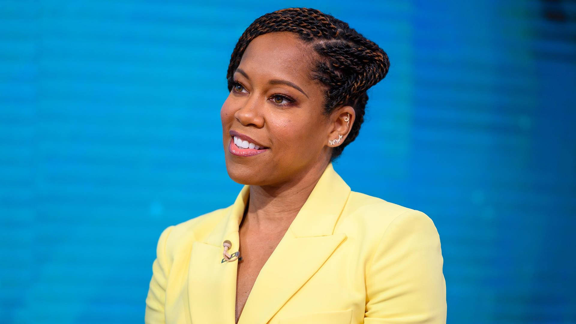 Regina King Blue And Yellow Background