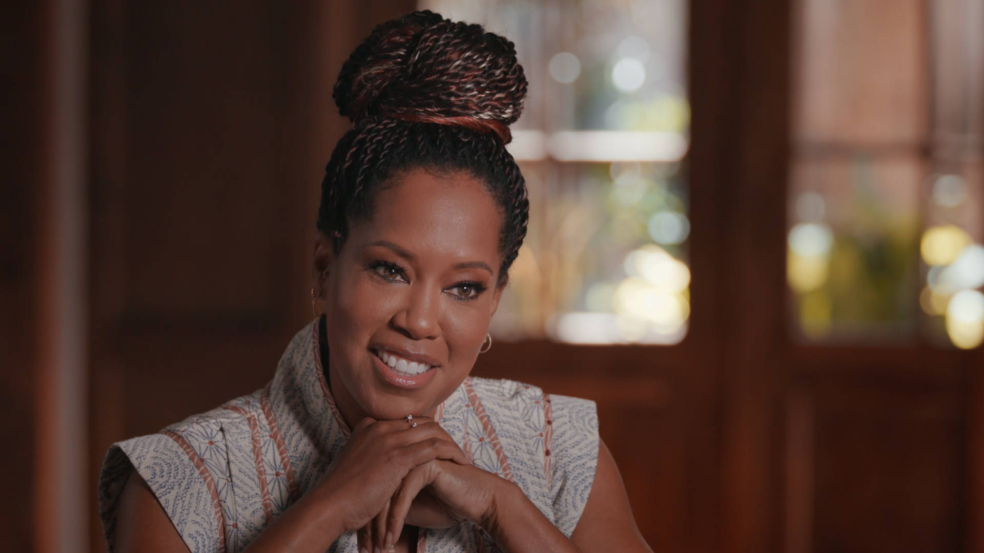 Regina King Hair Tied Up Brown Aesthetic Background