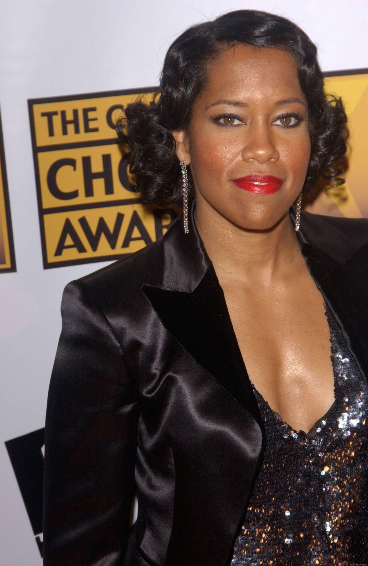 Regina King Shiny Black Dress Background