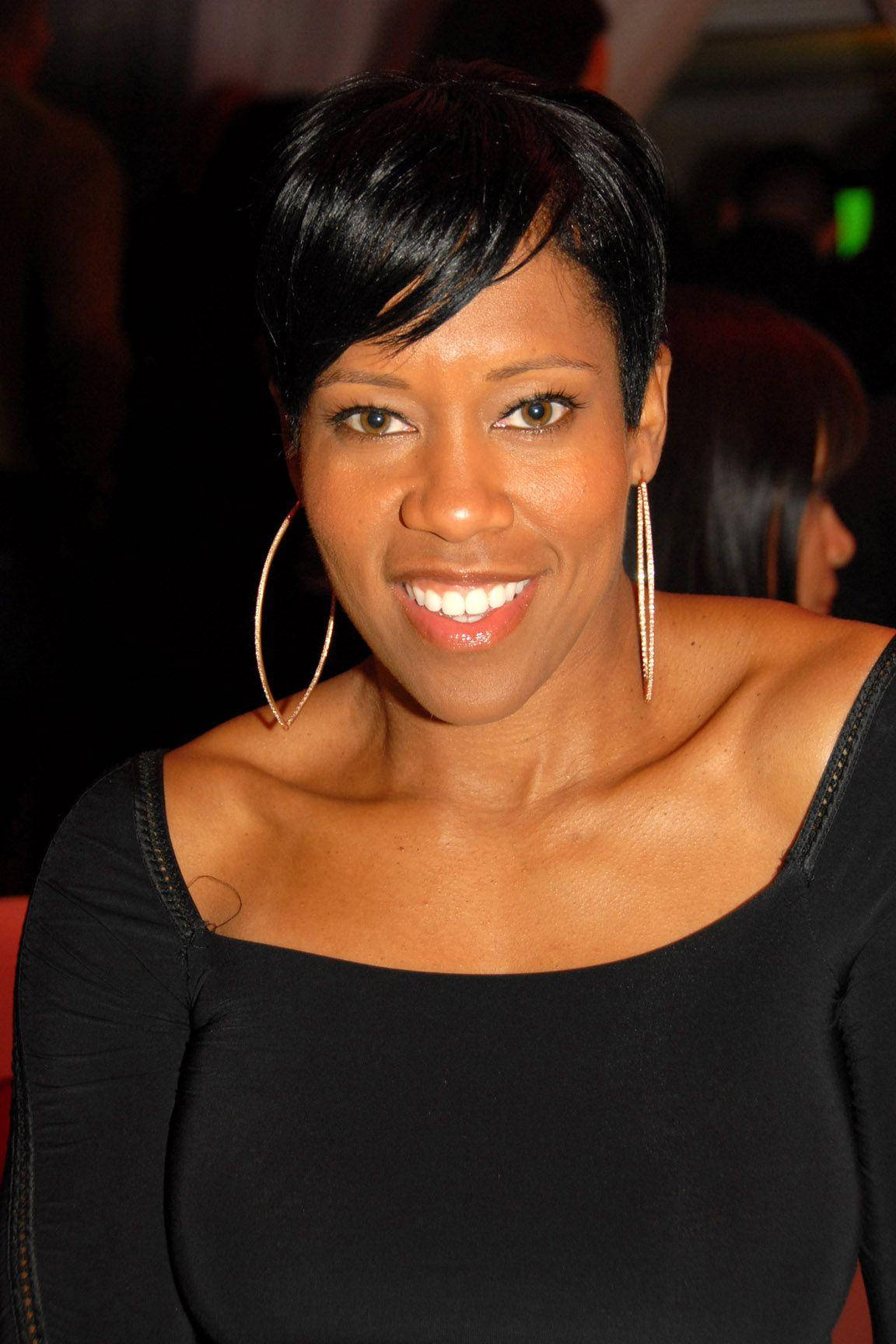 Regina King Smiling In Black Dress Portrait Background