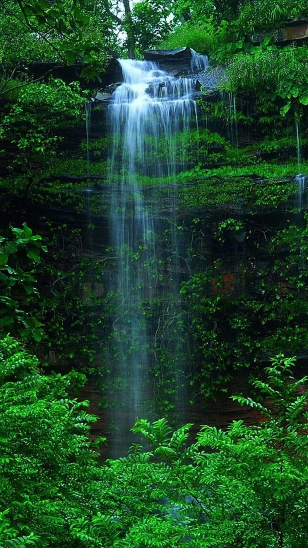 Rejuvenating Natural Waterfall From Iphone Perspective Background