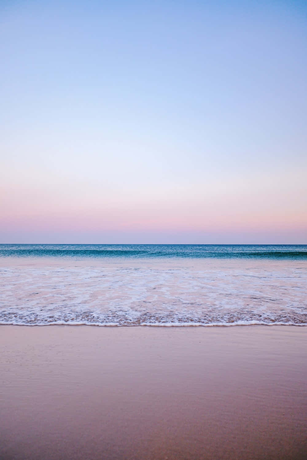 Relax On The Tranquil Pastel Coloured Beach, Perfect For Summer Days. Background