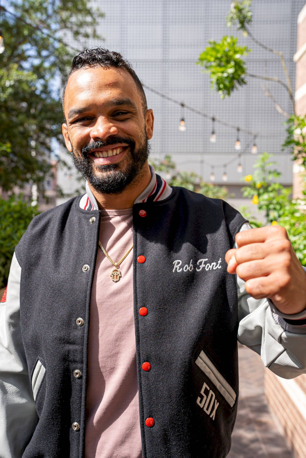 Relaxed And Ready: Rob Font In Casual Attire Background