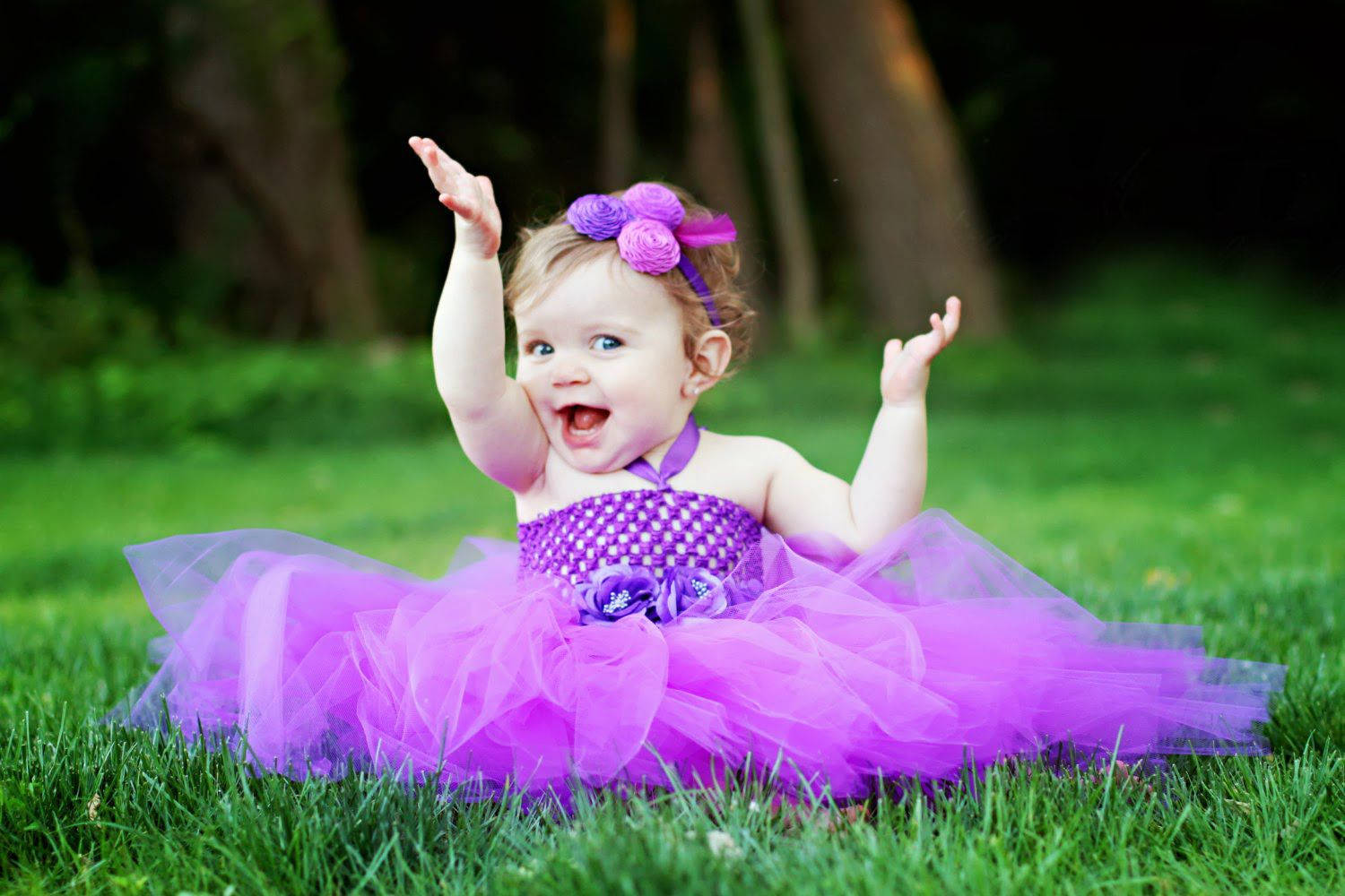 Relaxed Baby In A Soft Purple Gown