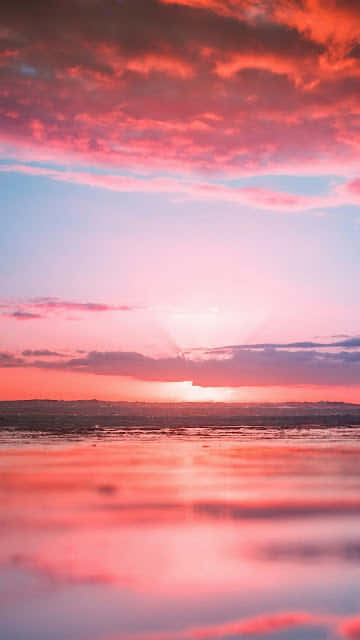 Relaxing At The Beach With A Beautiful Pink Aesthetic Background