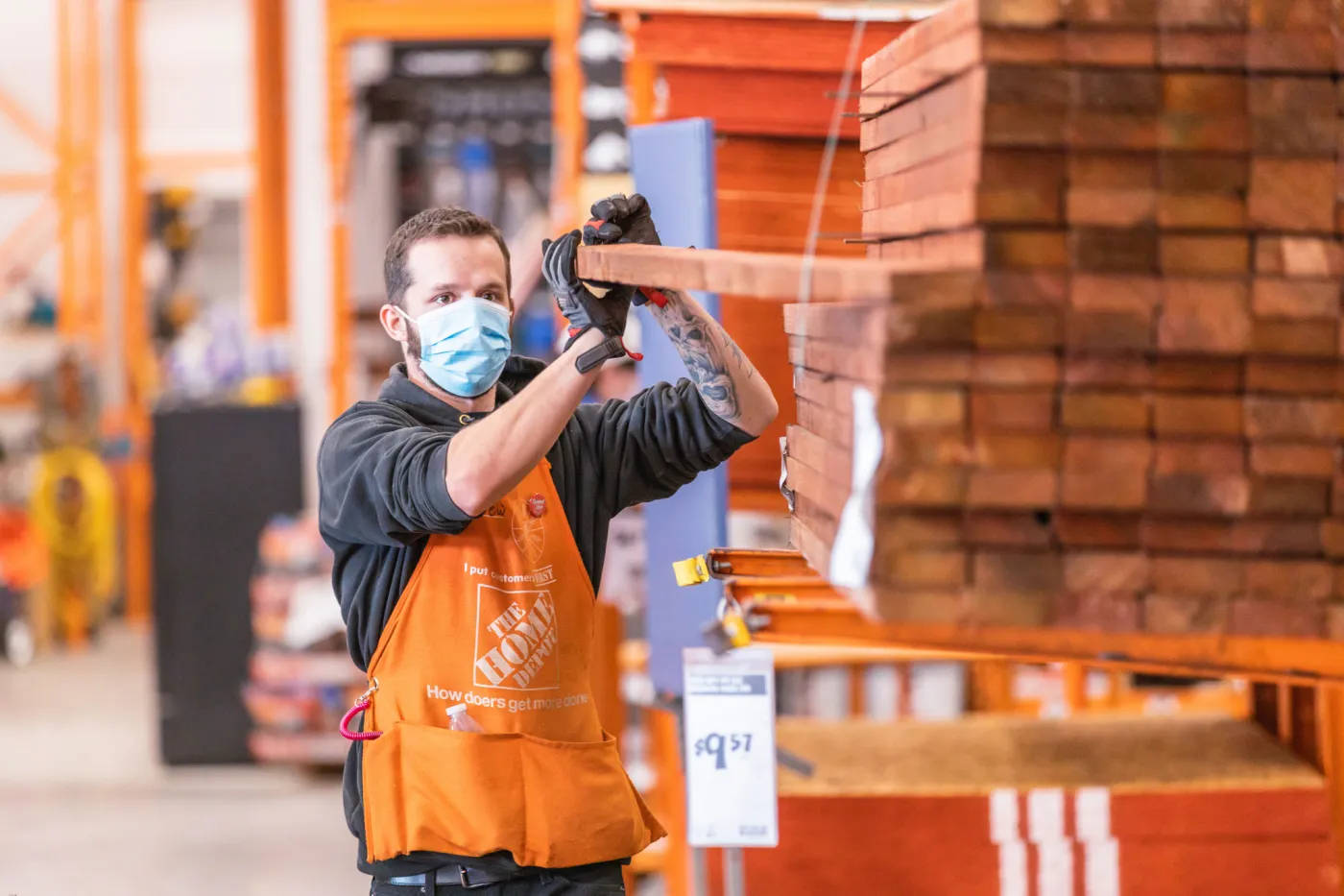 Reliable Home Depot Employee Serving Shoppers Background