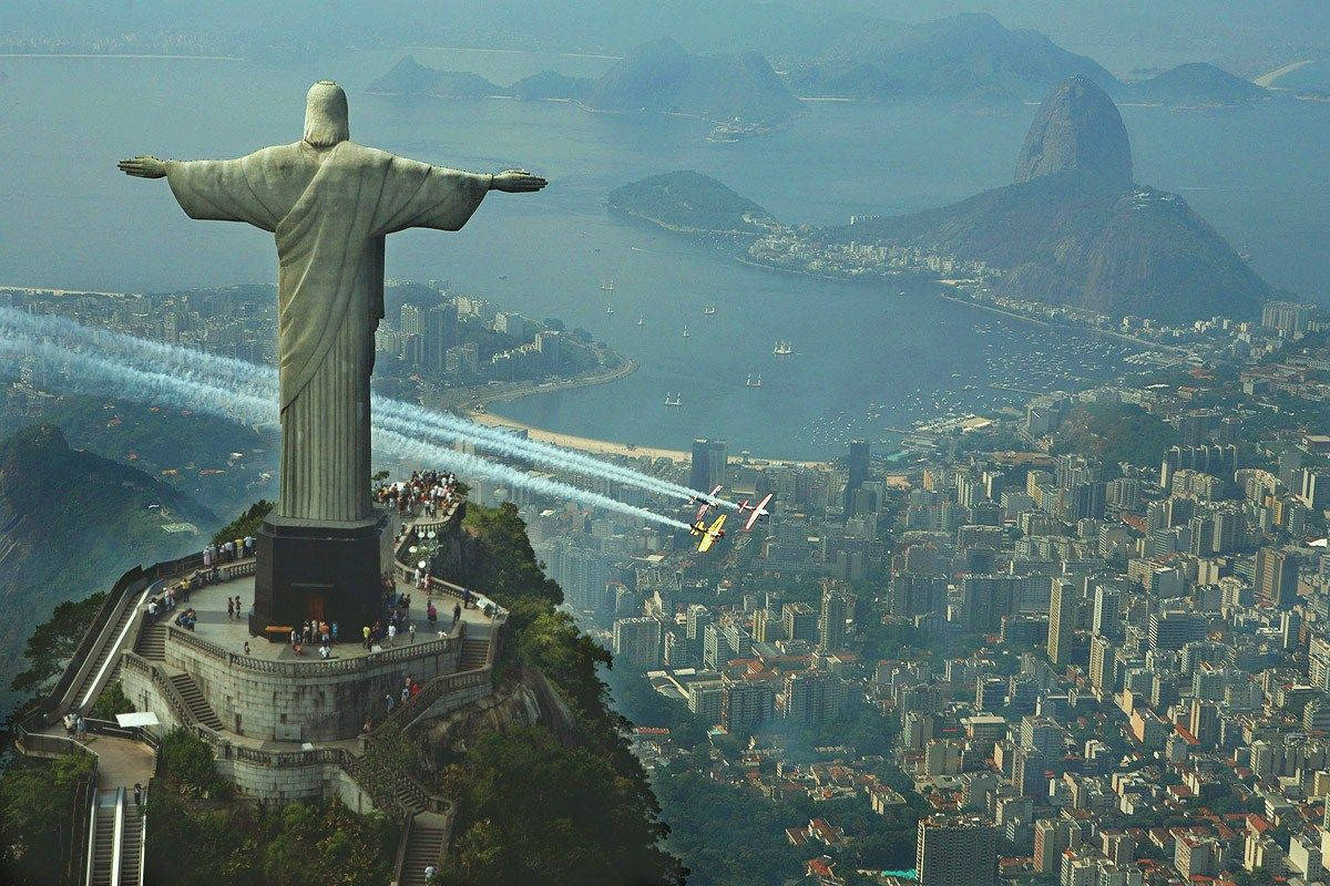 Religious Christ Statue In Rio Background