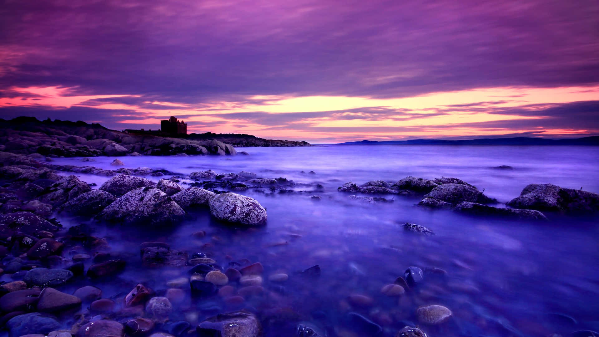 Relish The Vivid Beauty Of A Blue And Purple Sunset Background