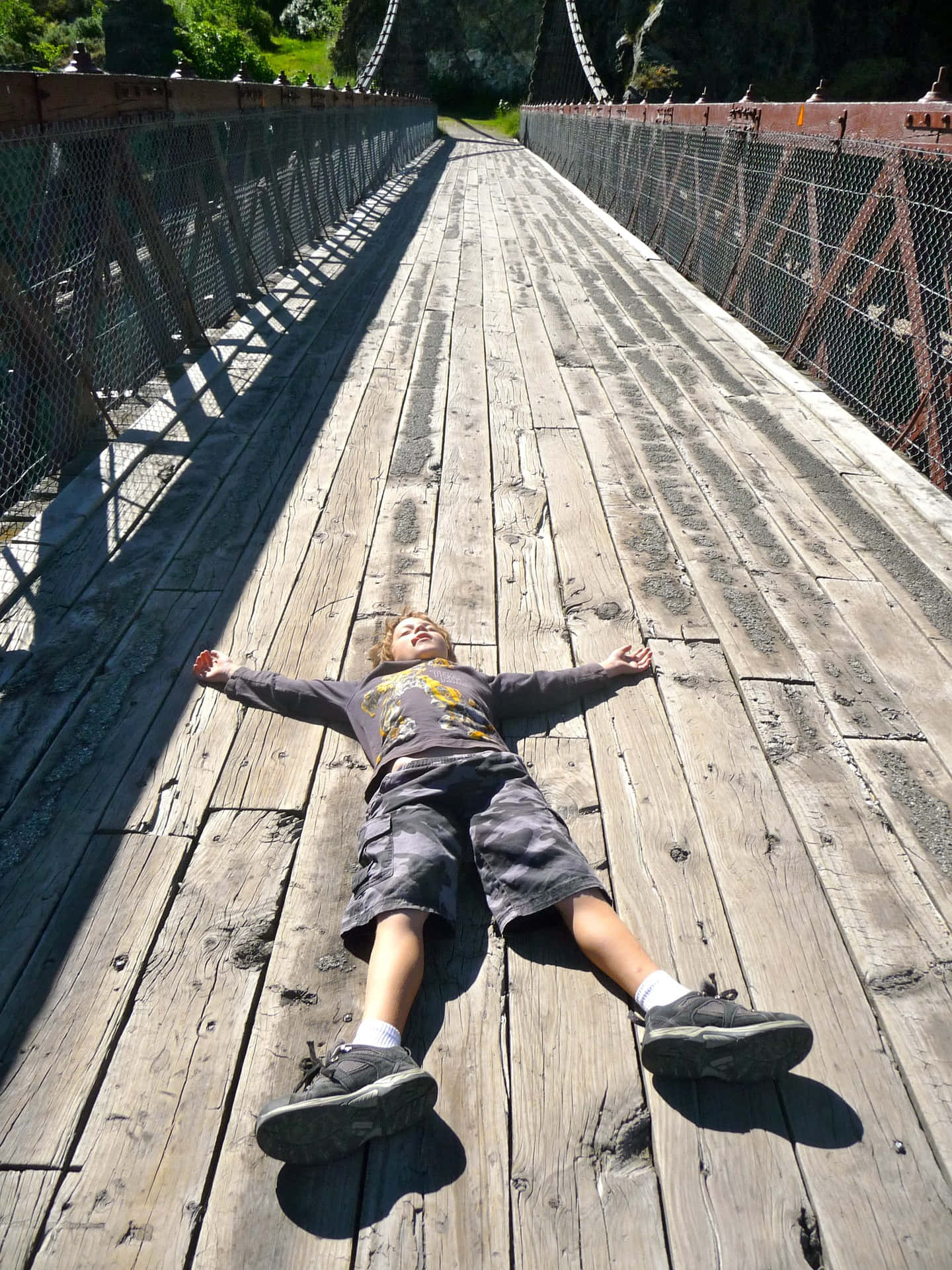 Reluctant Boy On Bridge Background