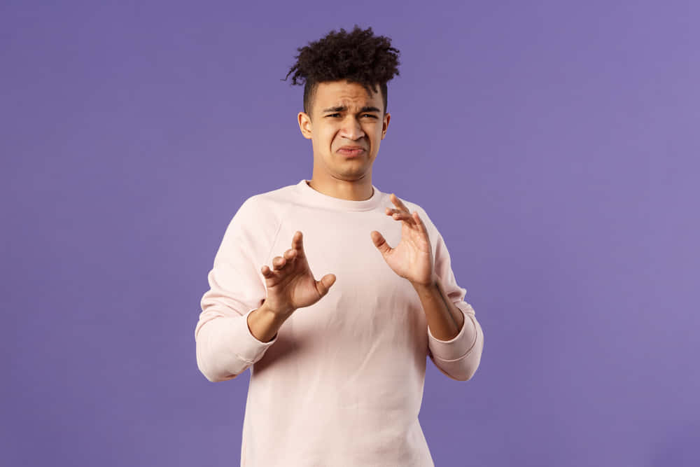 Reluctant Man Exhibiting A Sour Face Background