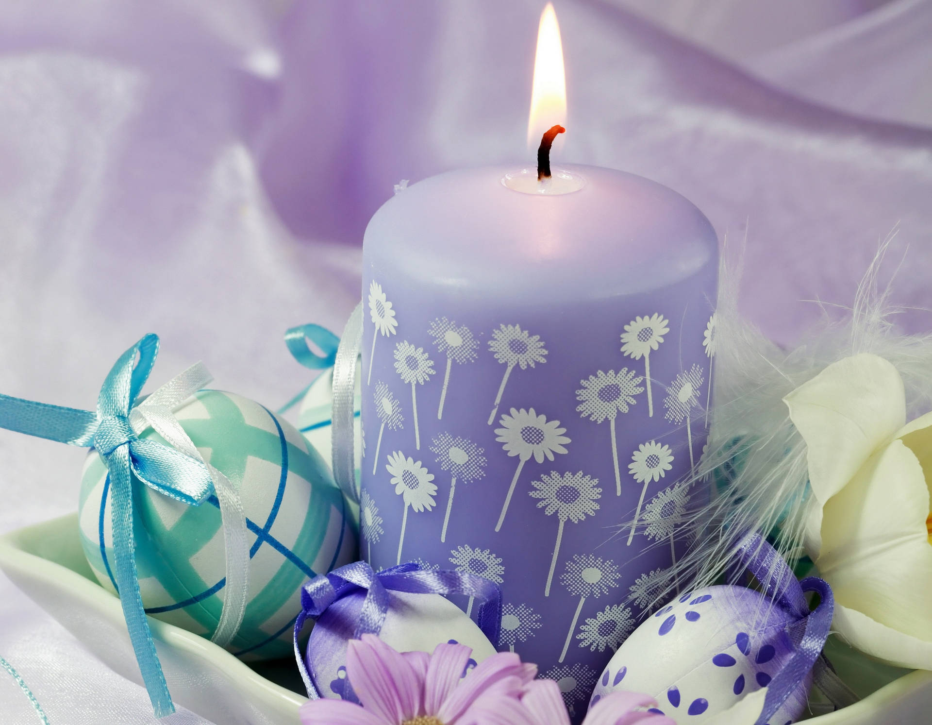 Remember The Reason For This Season This Easter With The Peaceful And Calming Glow Of A Candle. Background