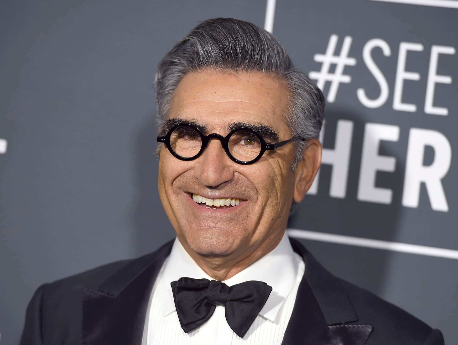 Renowned Actor Eugene Levy Smiling During An Entertainment Event Background