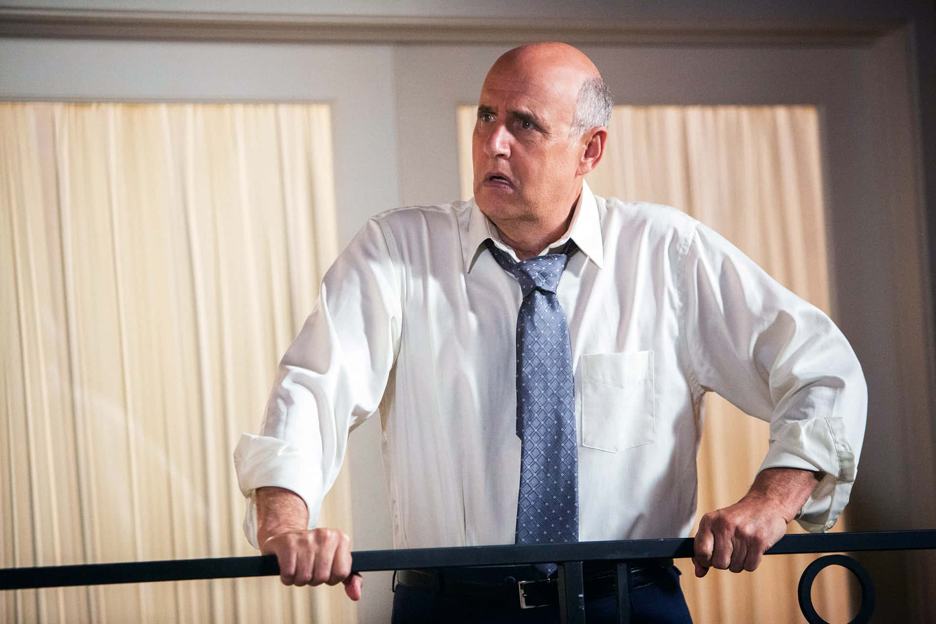 Renowned Actor Jeffrey Tambor Giving A Charismatic Smile In A Professional Shoot. Background