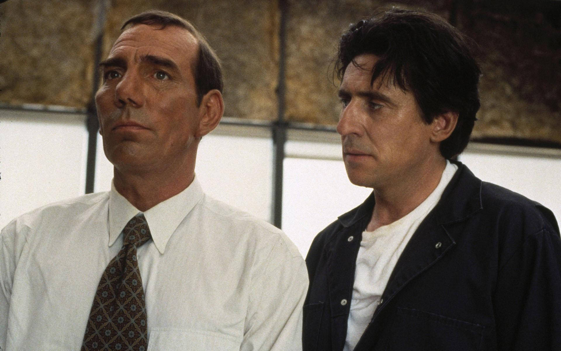 Renowned Actors Pete Postlethwaite And Gabriel Byrne In A Scene