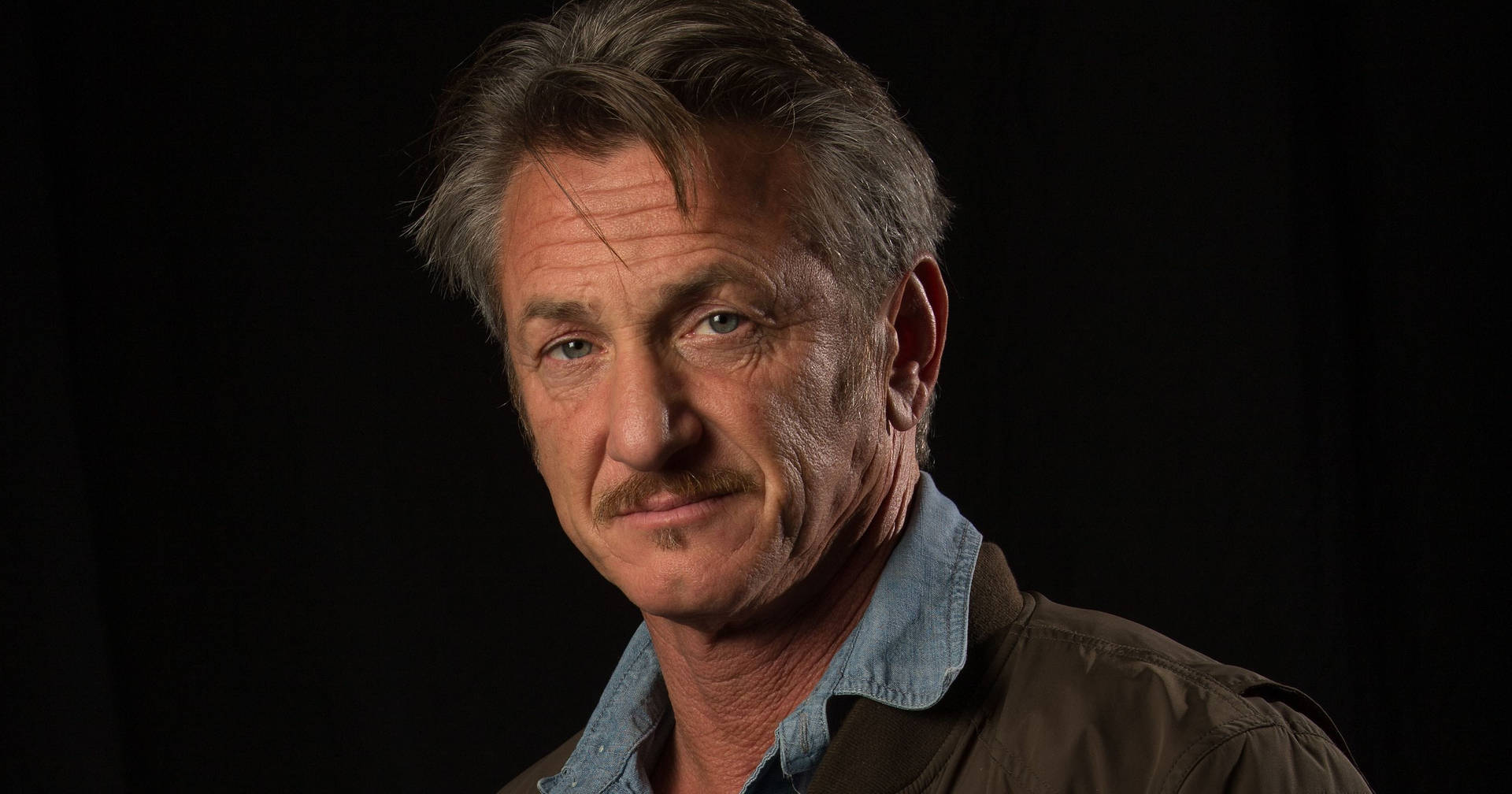 Renowned American Actor, Sean Penn In A Contemplative Pose. Background