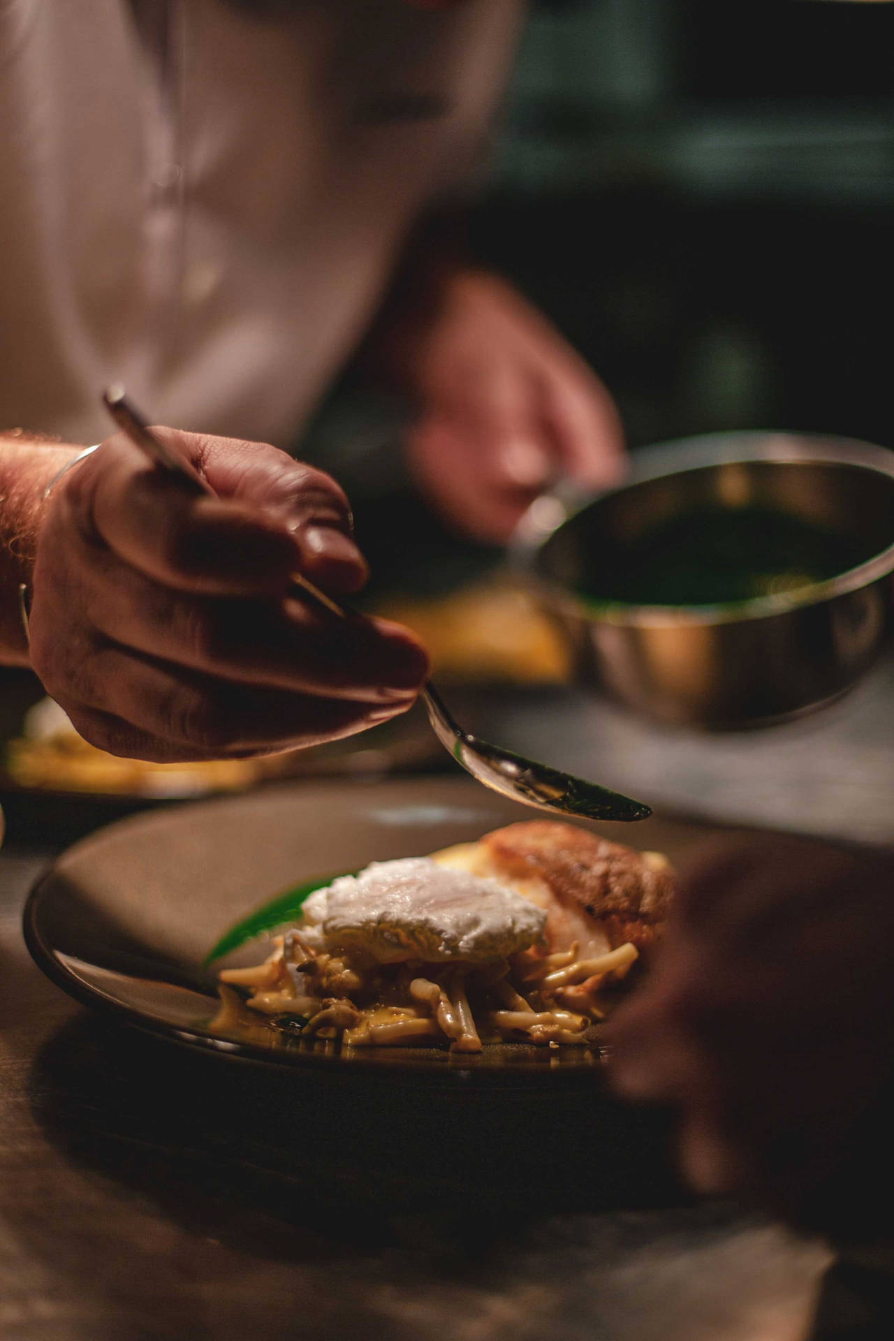 Renowned Chef Crafting A Gourmet Dish Background