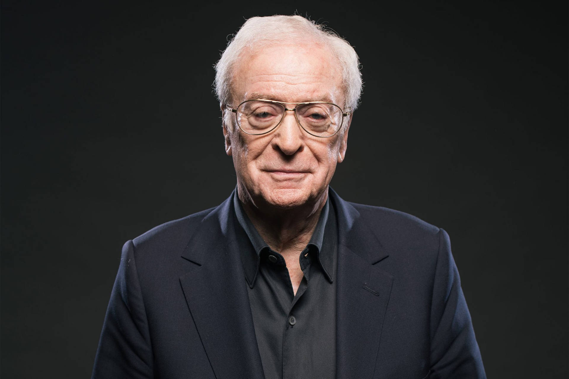 Renowned English Actor Michael Caine Exuding Elegance In Black