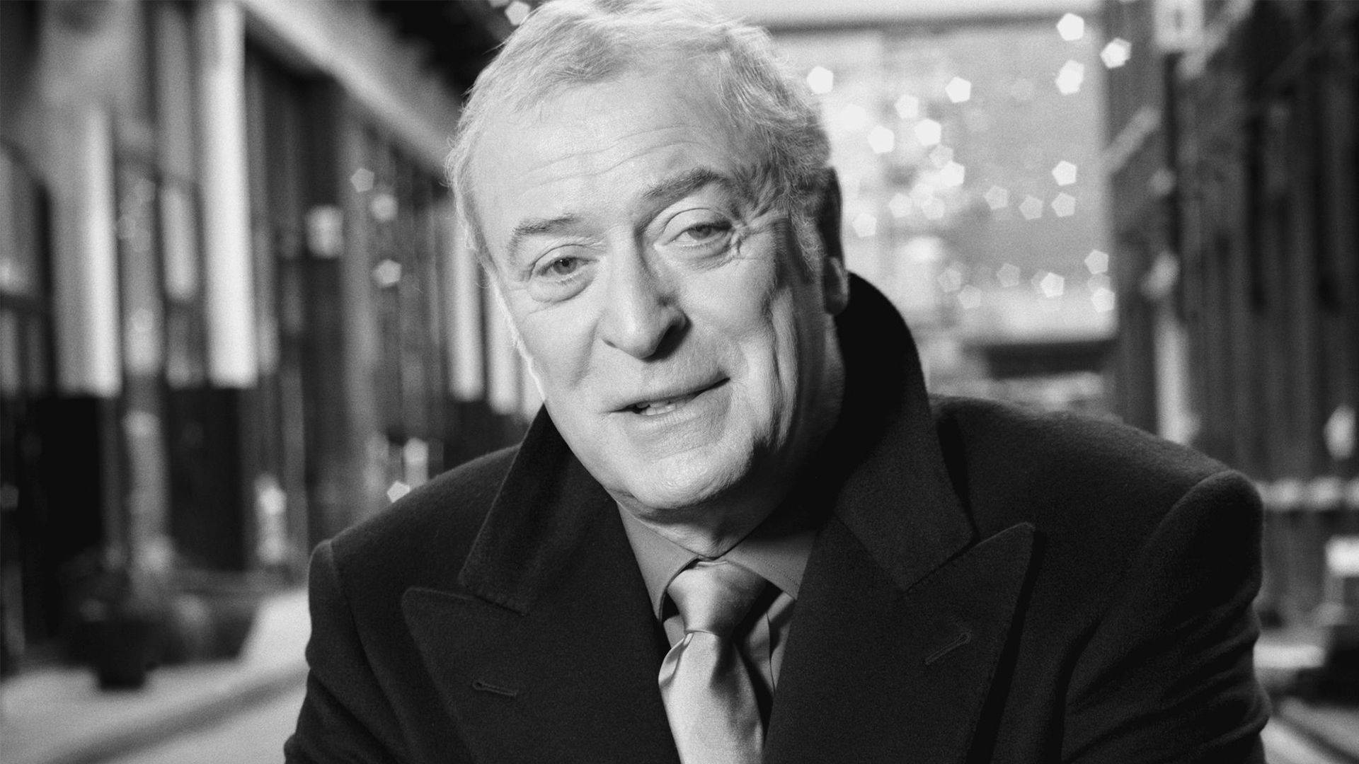 Renowned English Actor, Sir Michael Caine In Monochrome Background