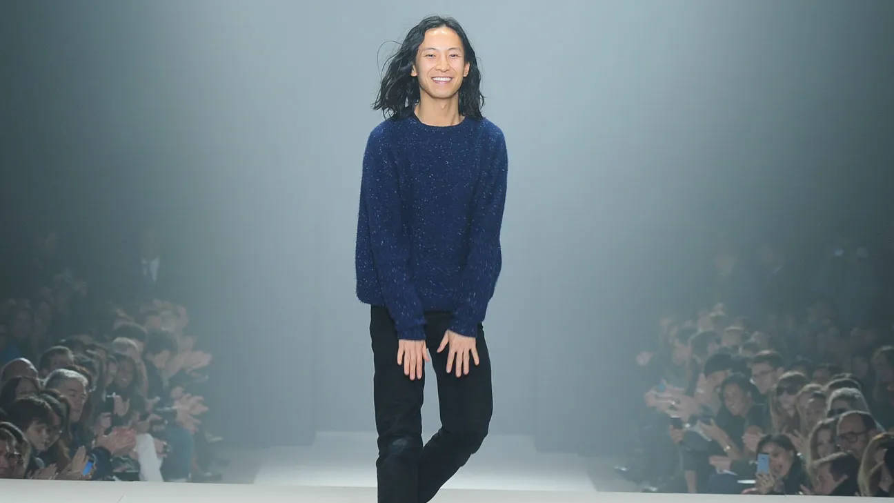 Renowned Fashion Designer Alexander Wang Sporting A Stylish Blue Sweater Background