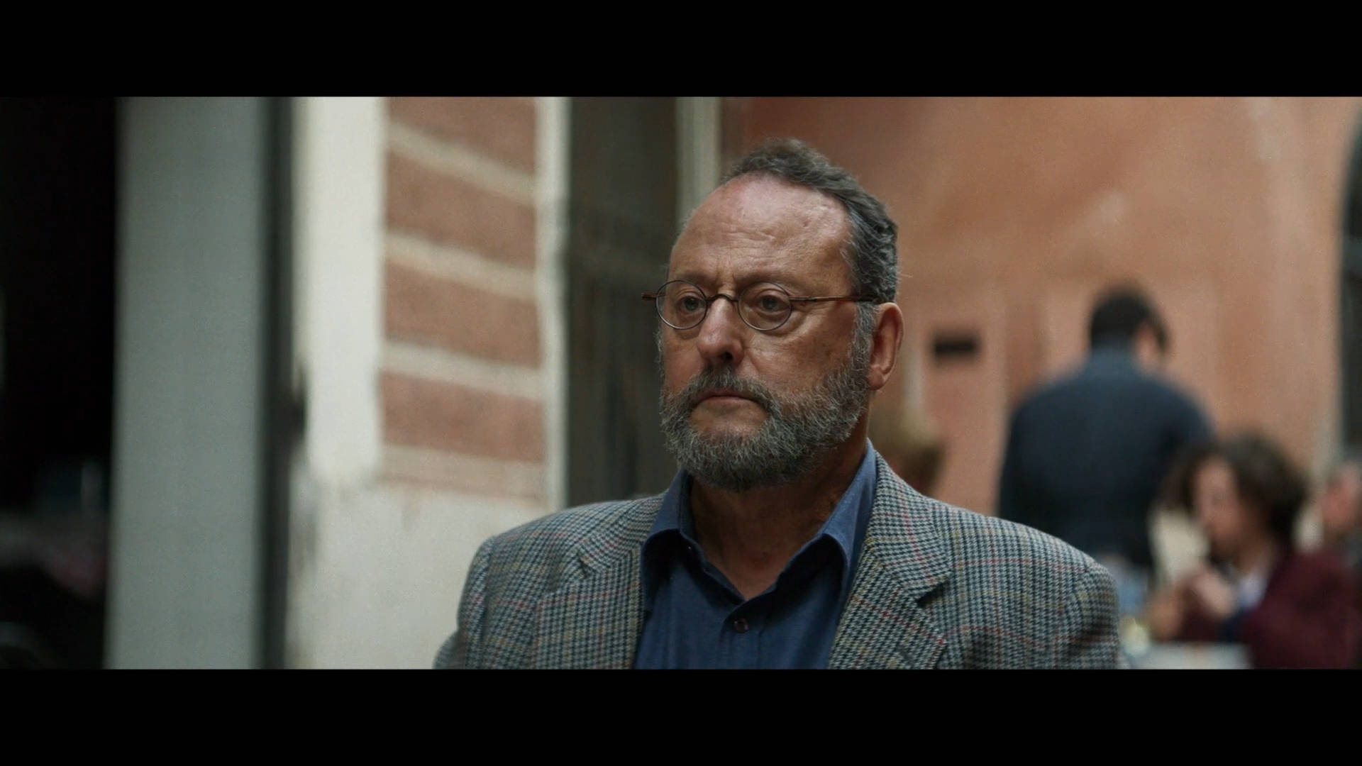 Renowned French Actor Jean Reno In A Candid Still From One Of His European Movies