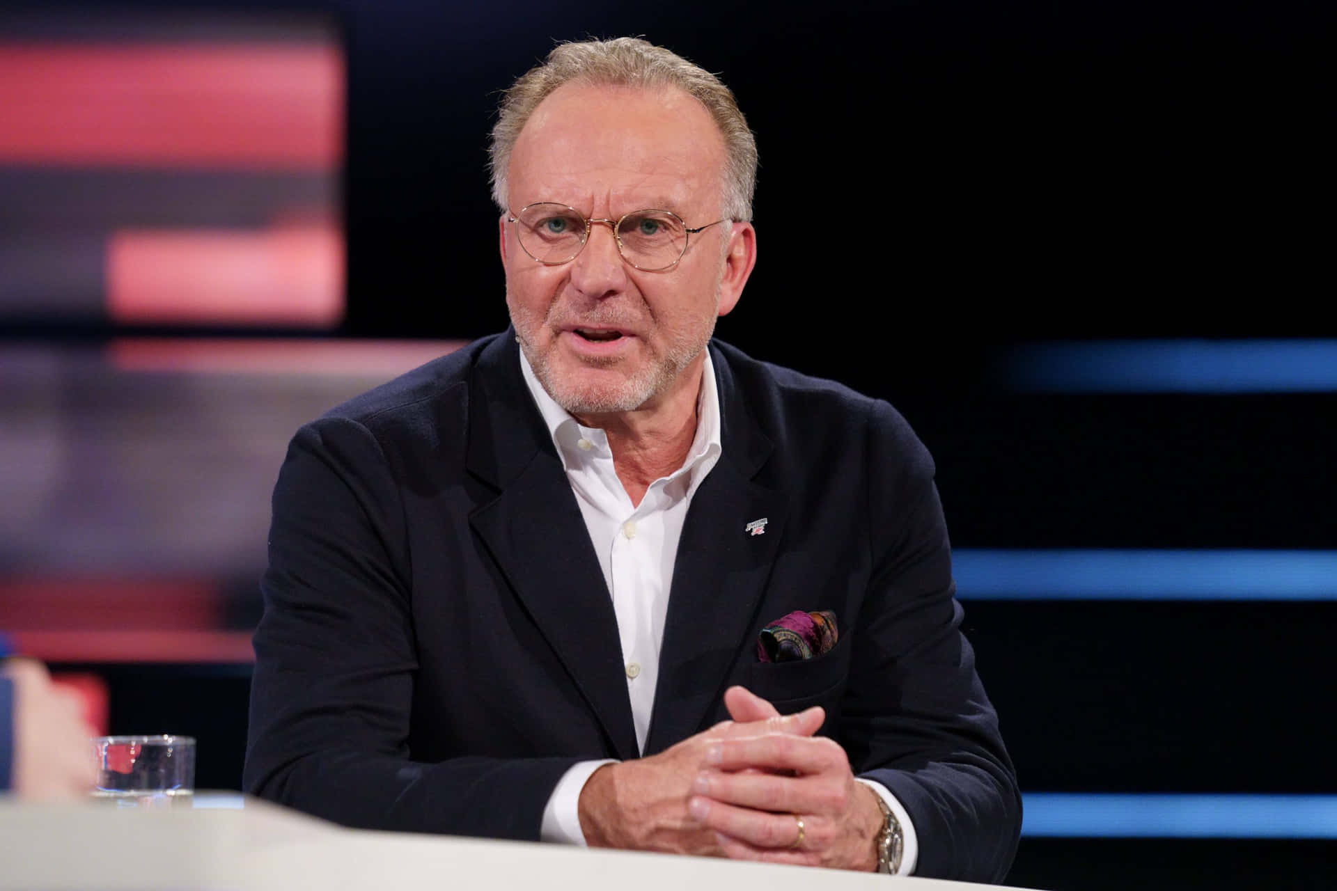 Renowned German Football Executive Karl-heinz Rummenigge Captured In Television Interview Background