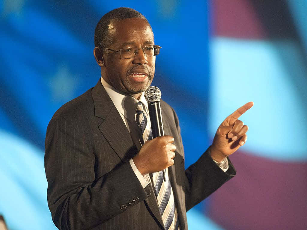 Renowned Neurosurgeon And Political Figure, Ben Carson, During A Public Talk Background