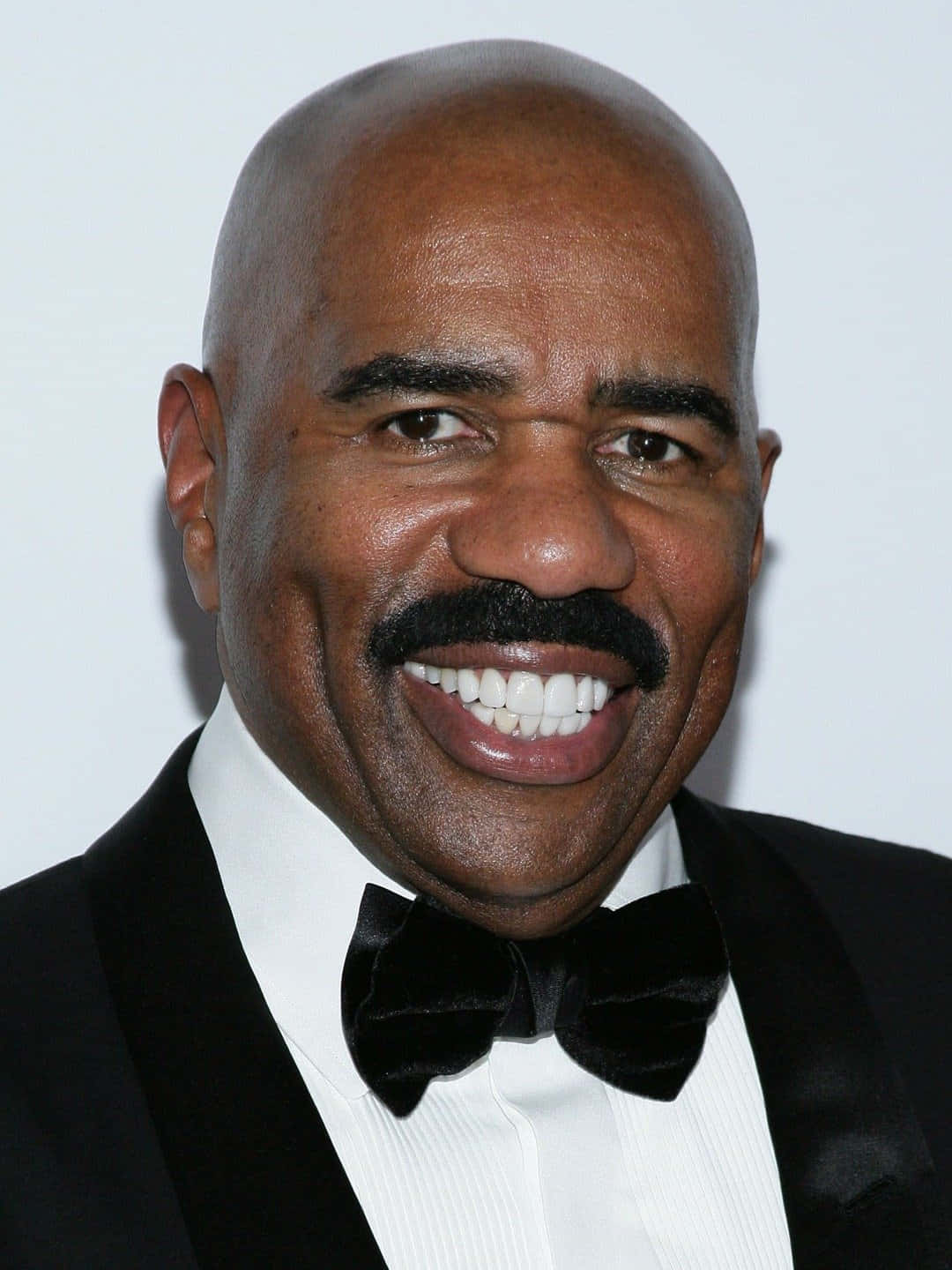 Renowned Television Personality, Steve Harvey, Captured In A Joyous Moment