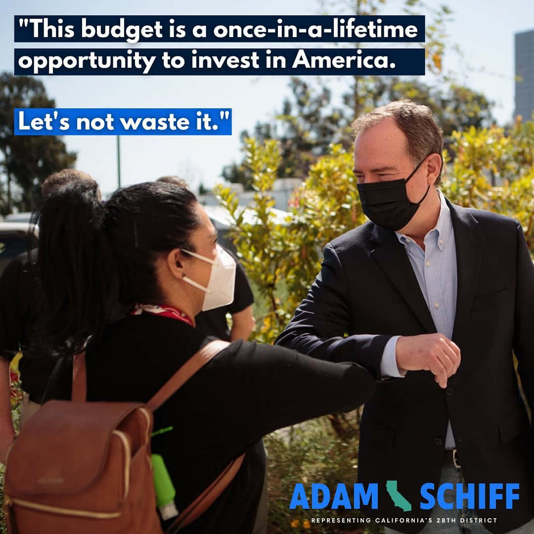 Representative Adam Schiff Engaging In A Playful Elbow Bump With A Young Girl