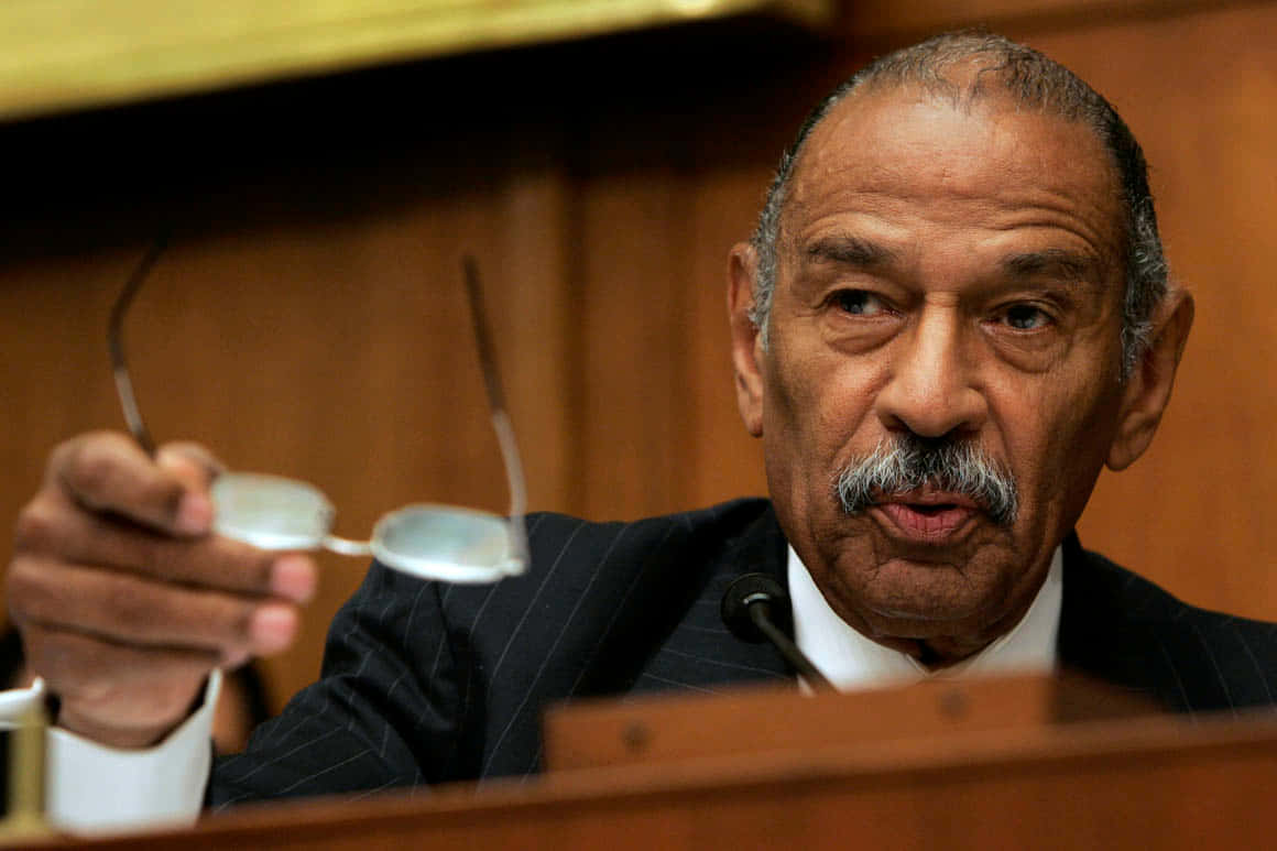 Representative John Conyers In A Formal Meeting Background