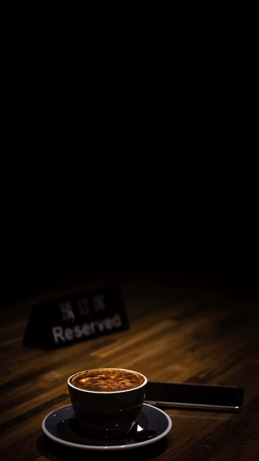 Reserved Sign On Table At Coffee Shop Background