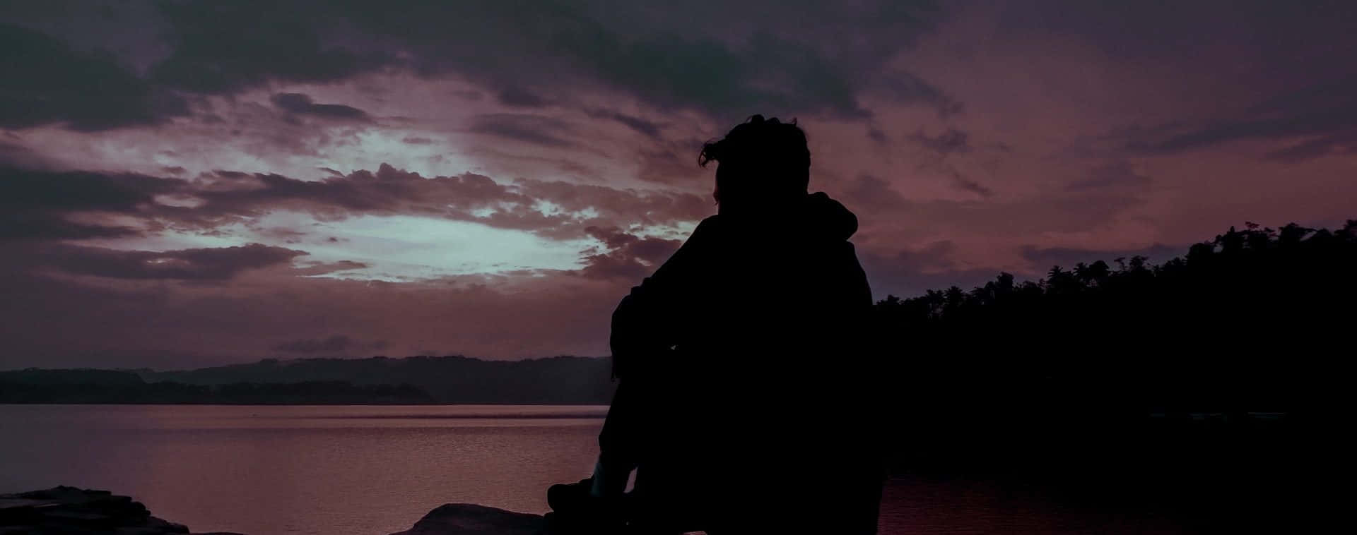 Resilient Man Captured Alone During Dark Hour Background