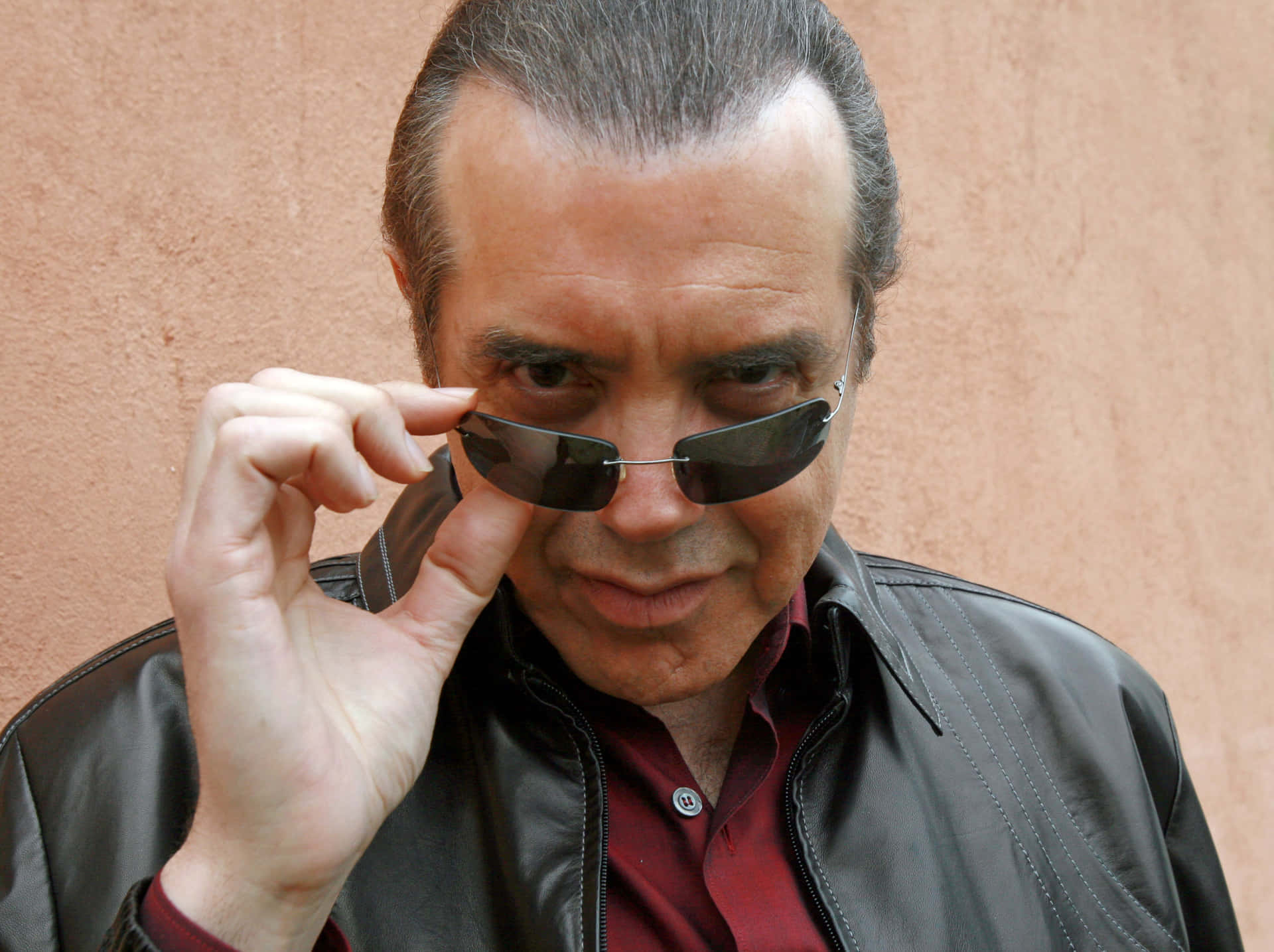 Respected Actor Chazz Palminteri Posing For A Photoshoot Background