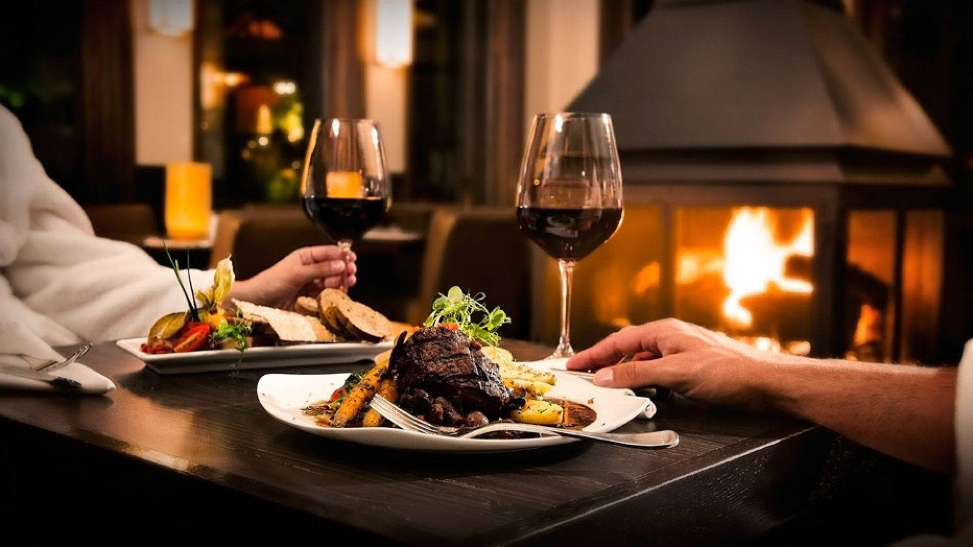 Restaurant Steak Dinner Over Fireplace Background