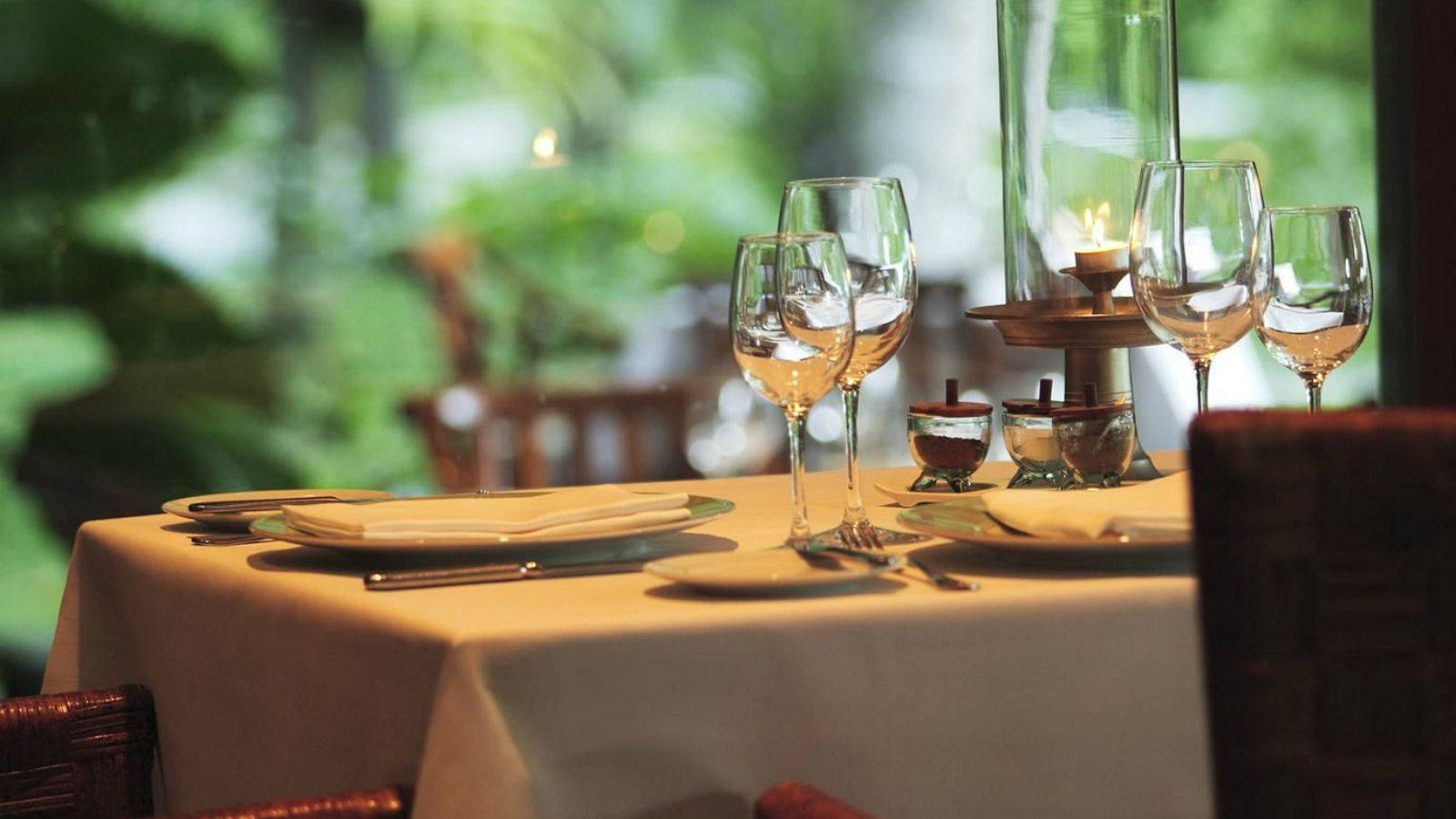 Restaurant Table Setting With Candlelight