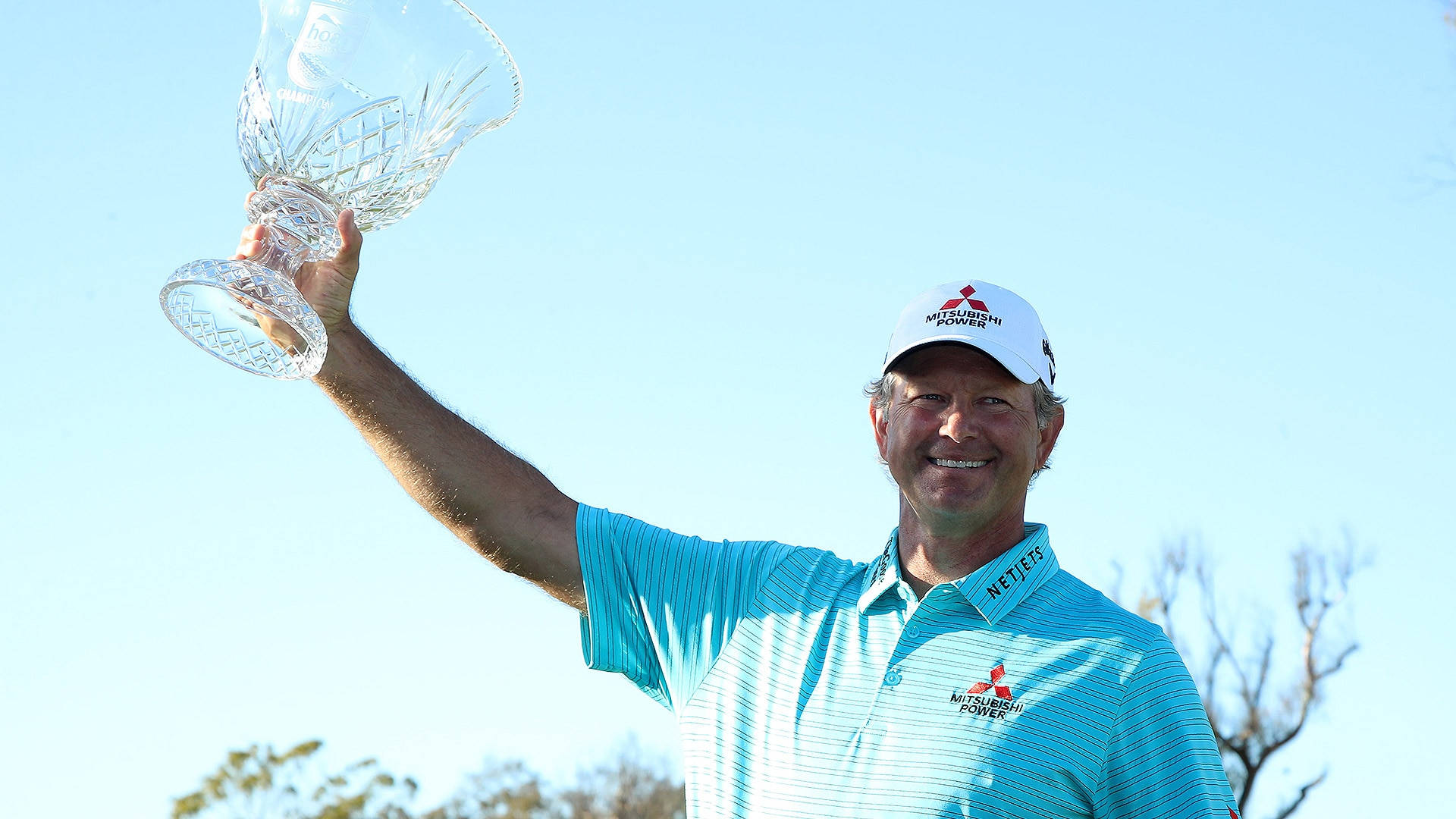 Retief Goosen Holding A Trophy