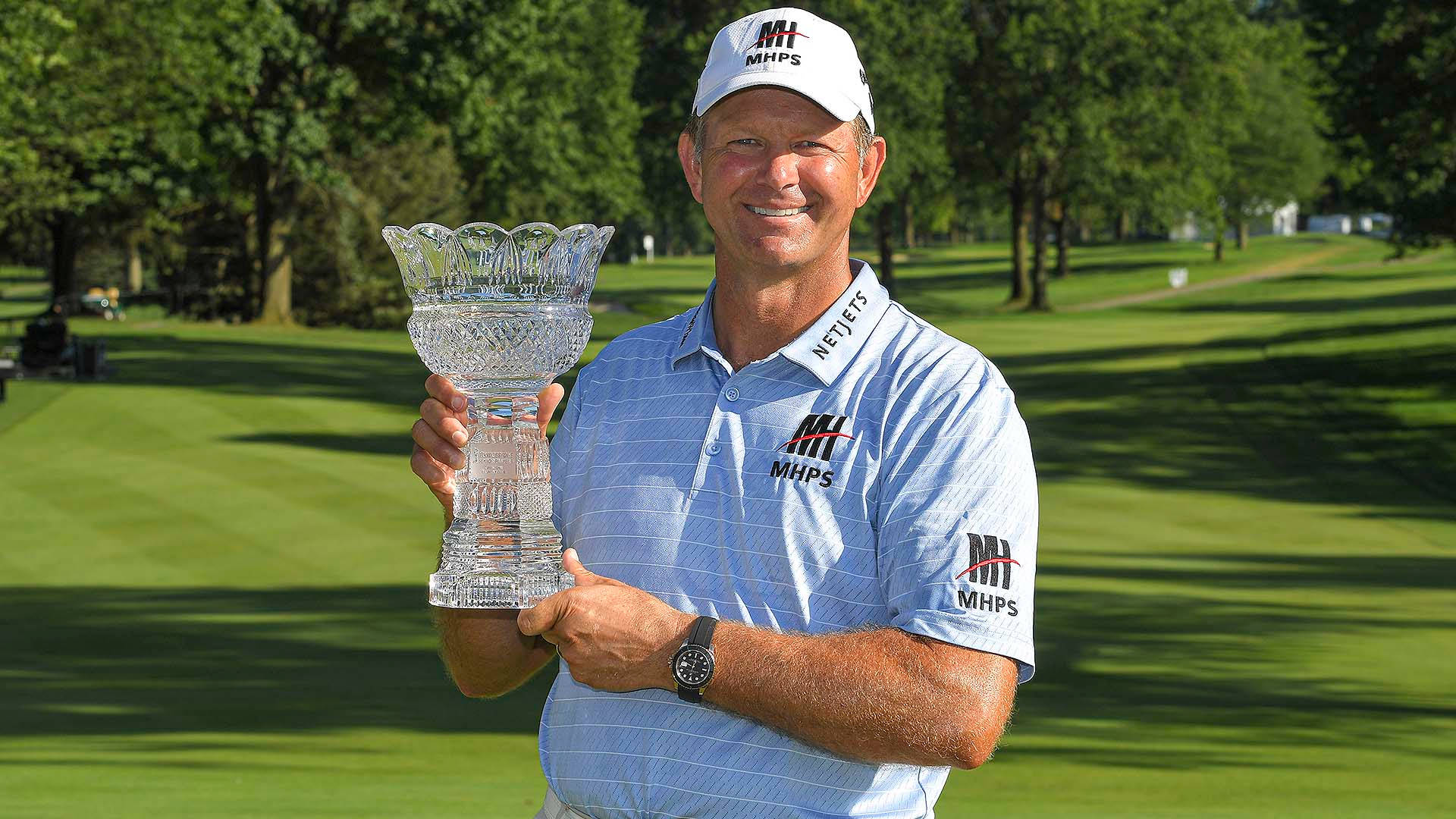 Retief Goosen Holding His Shimmering Crystal Trophy