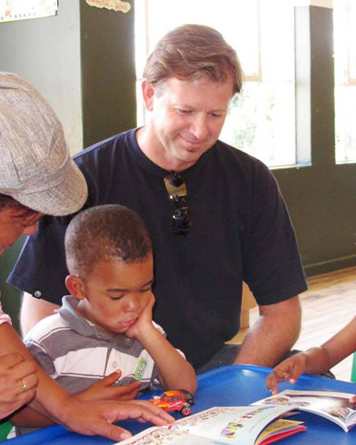 Retief Goosen Reading With A Child