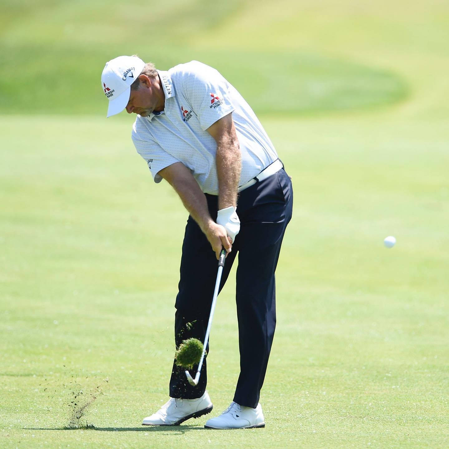 Retief Goosen Taking A Divot