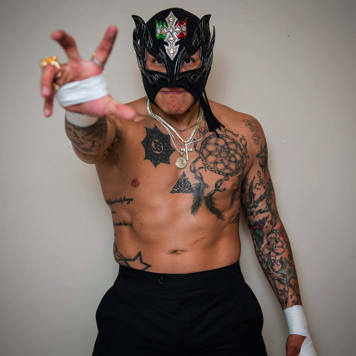 Rey Fenix Grabbing Poster Background