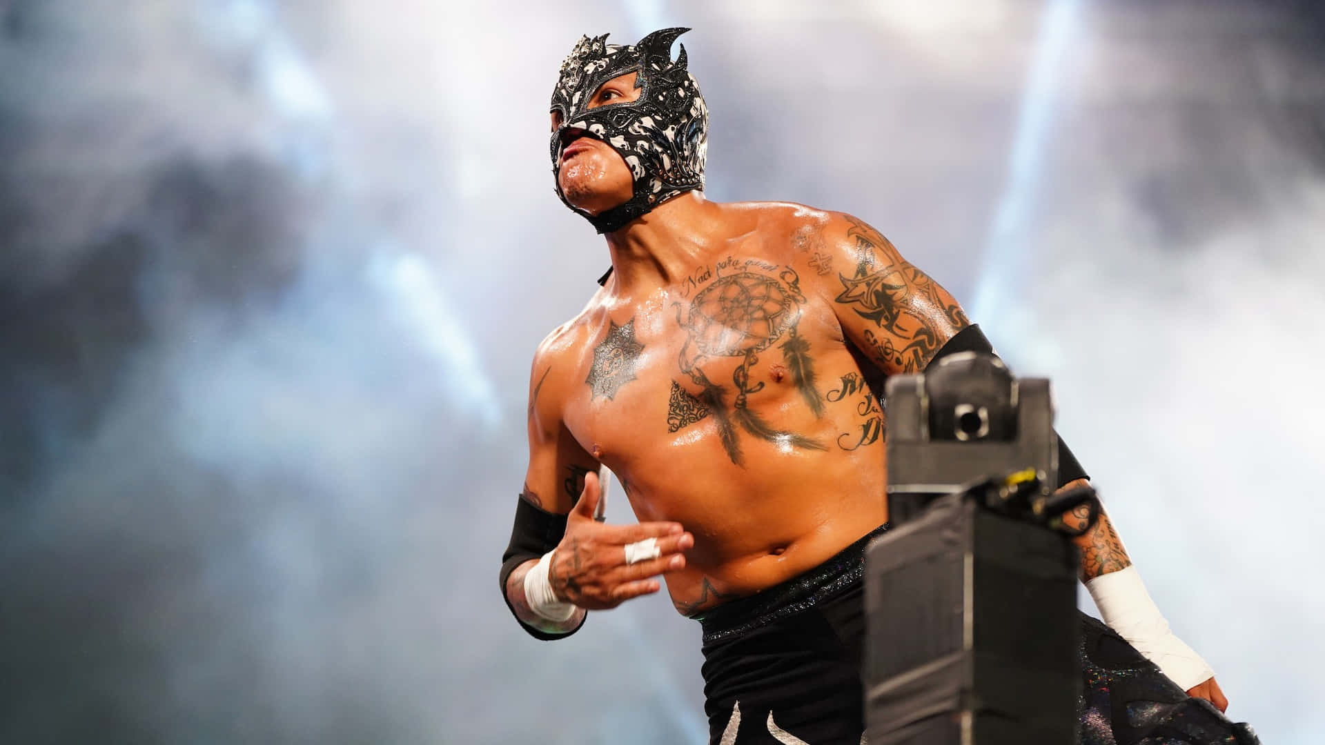 Rey Fenix Professional Wrestler On Top Of The Ring Background