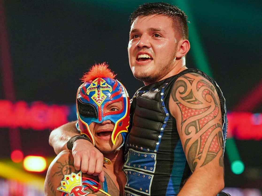 Rey_ Mysterio_and_ Companion_ Celebration Background