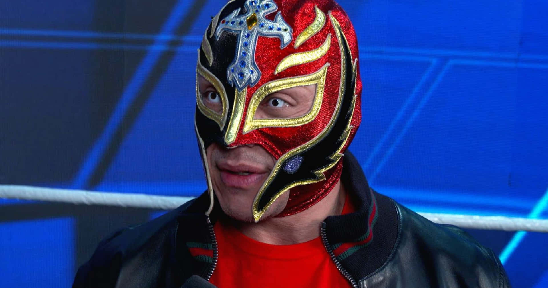 Rey_ Mysterio_ Closeup_in_ Ring_ Gear Background