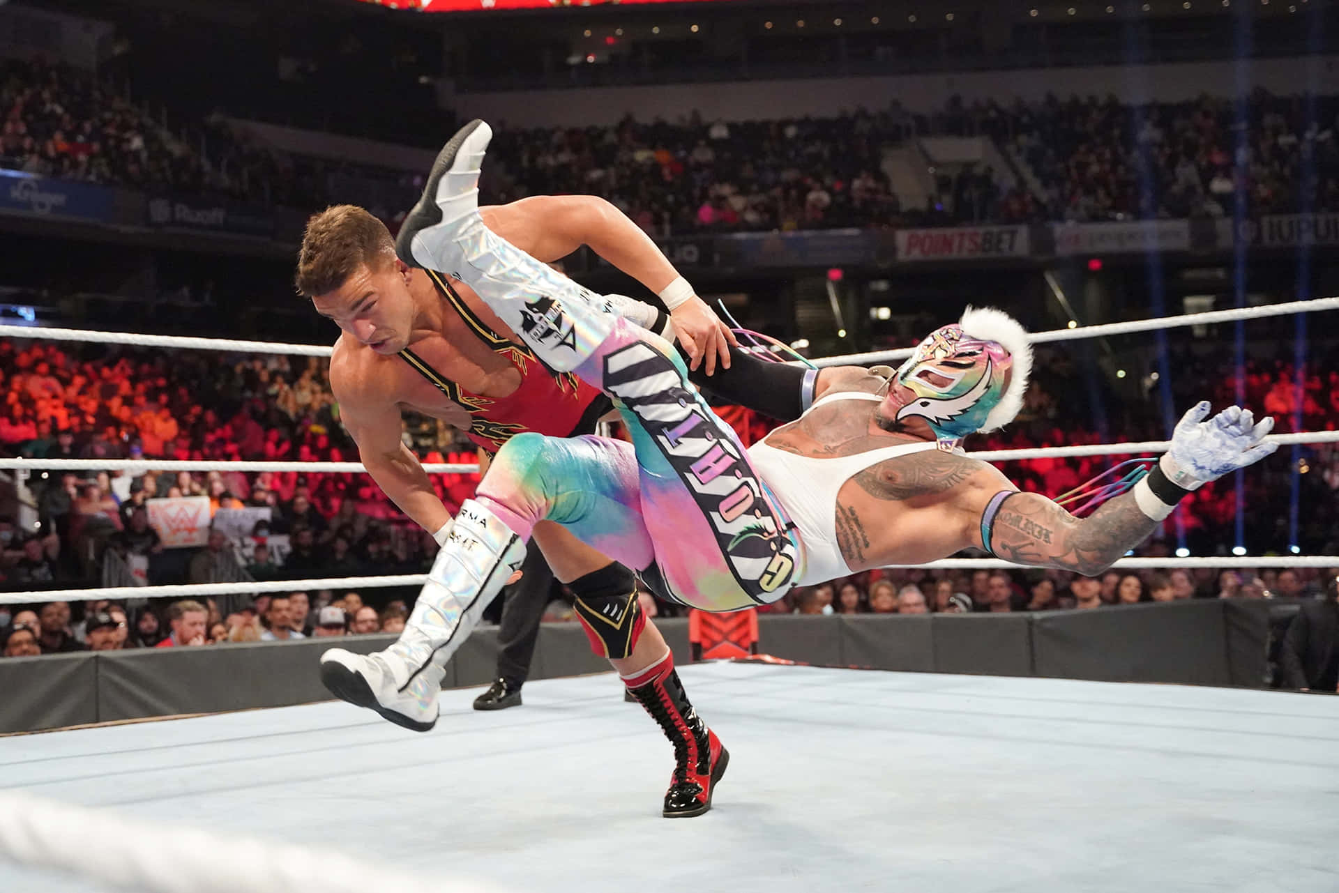 Rey Mysterio In Action Wrestling Match Background