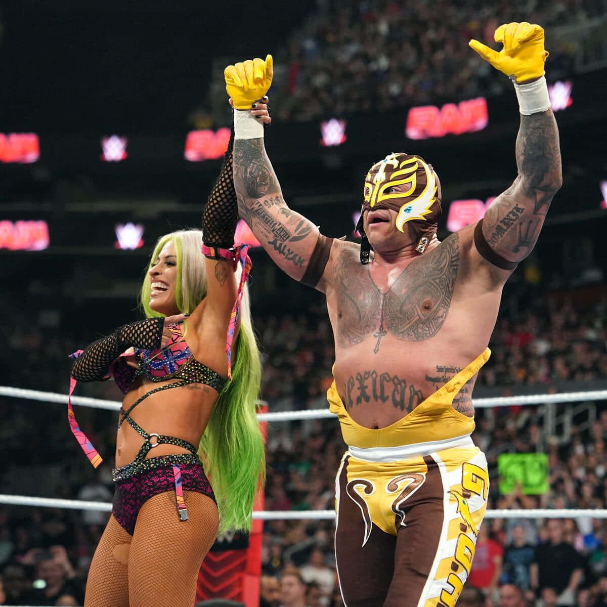 Rey_ Mysterio_ Victory_ Celebration_with_ Female_ Wrestler