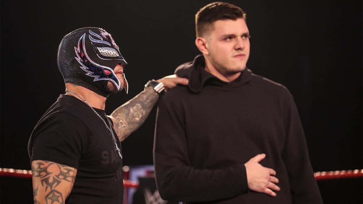 Rey Mysterio With Unmasked Individual Background