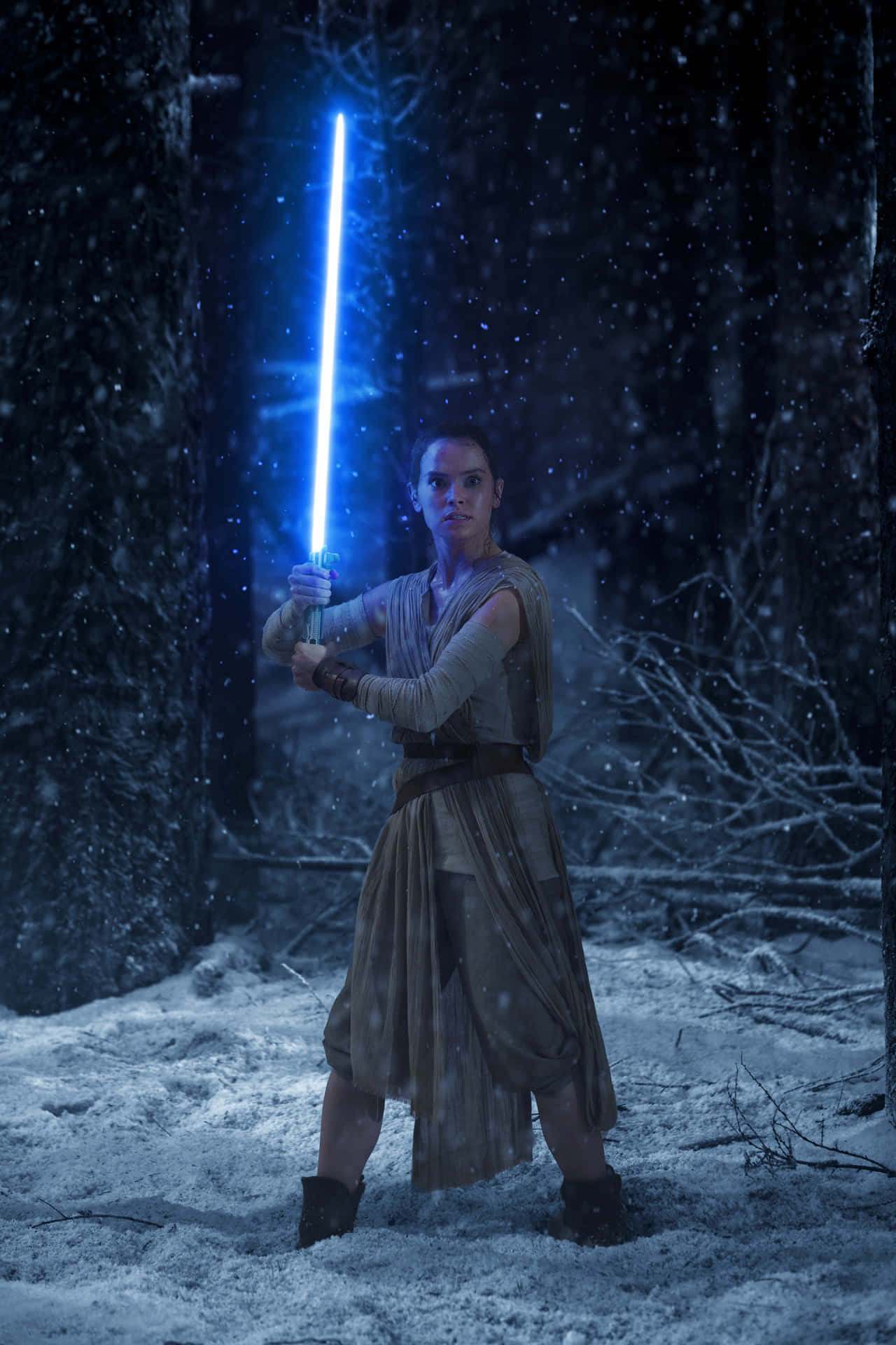 Rey With Her Lightsaber In Star Wars Background